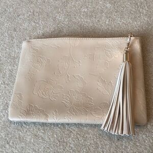 Embossed clutch